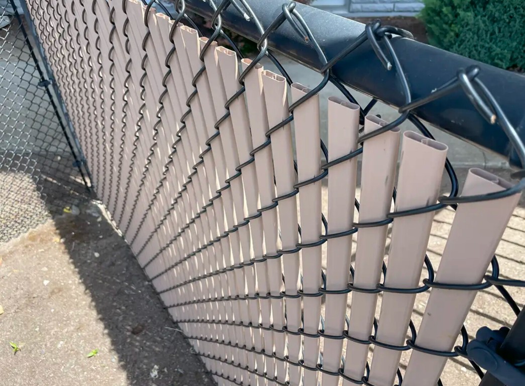 Chain-link fence with privacy slats for commercial property in Castro Valley